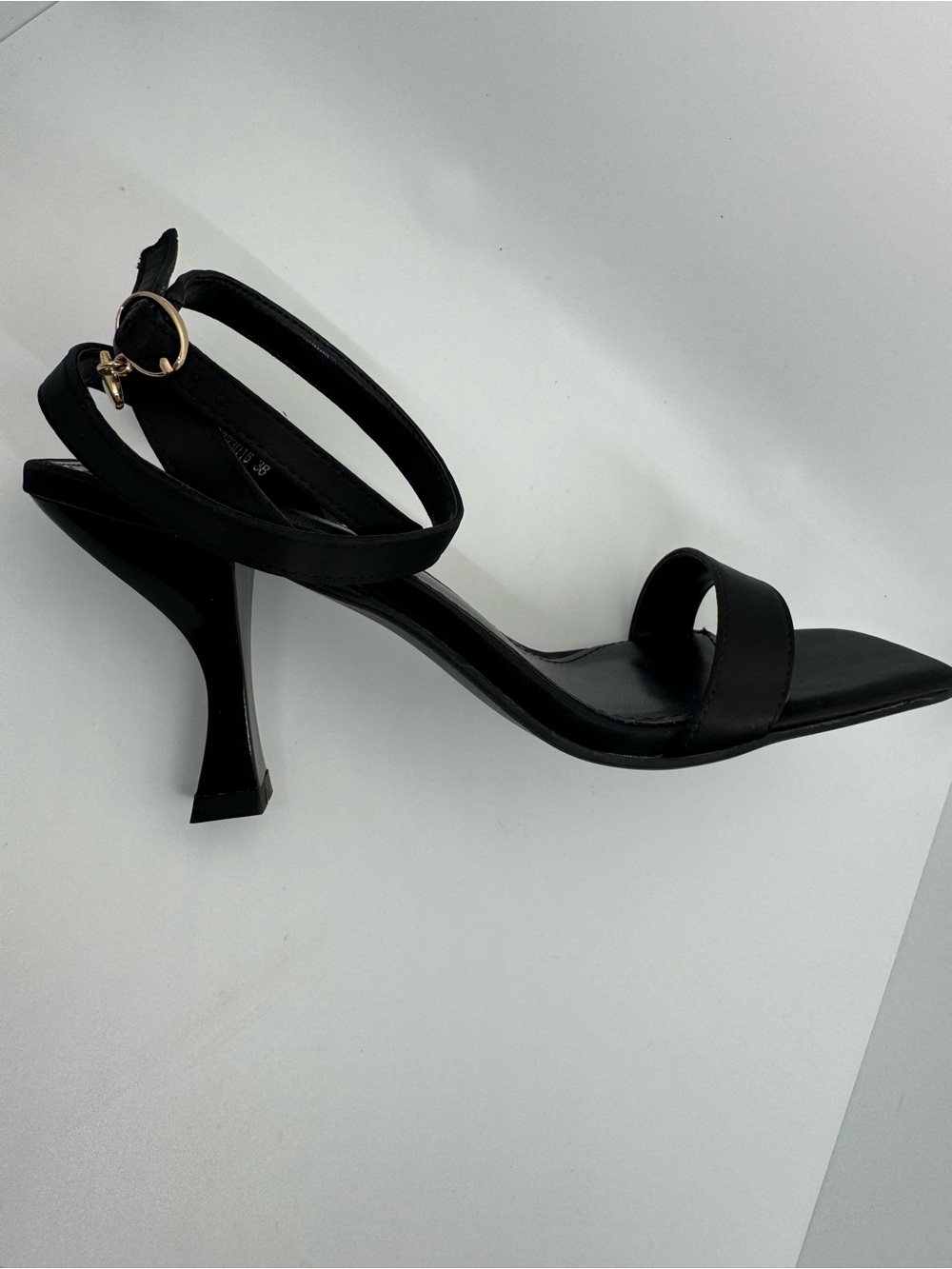 Black square heel sandal with ankle strap and heart charm